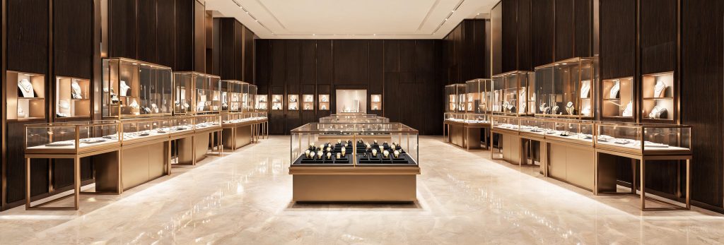 Glass jewelry display showcases and center island cabinet in a boutique jewelry store
