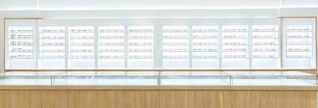 Optical store eyewear wall display shelves and dispensing counter