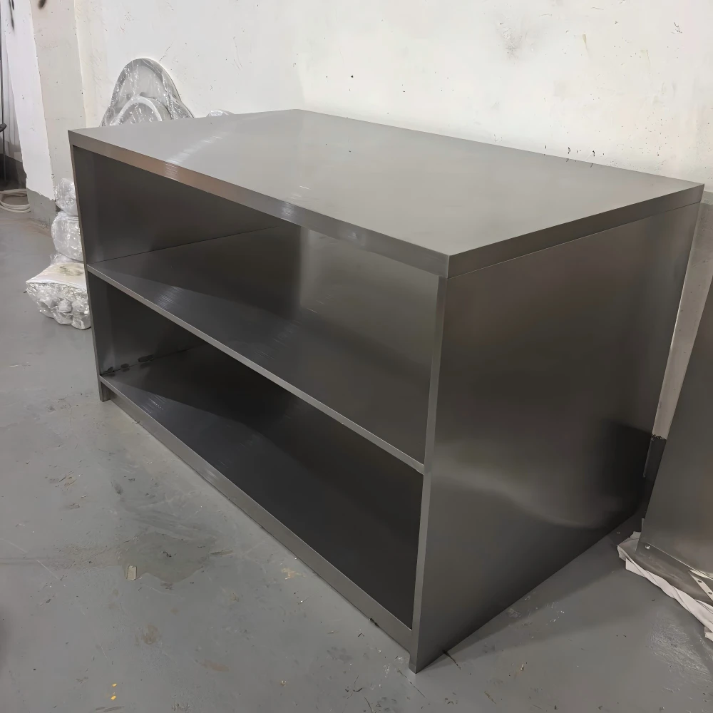 Stainless open shelving unit with three tiers and a matching peach lacquer side module in this production sample