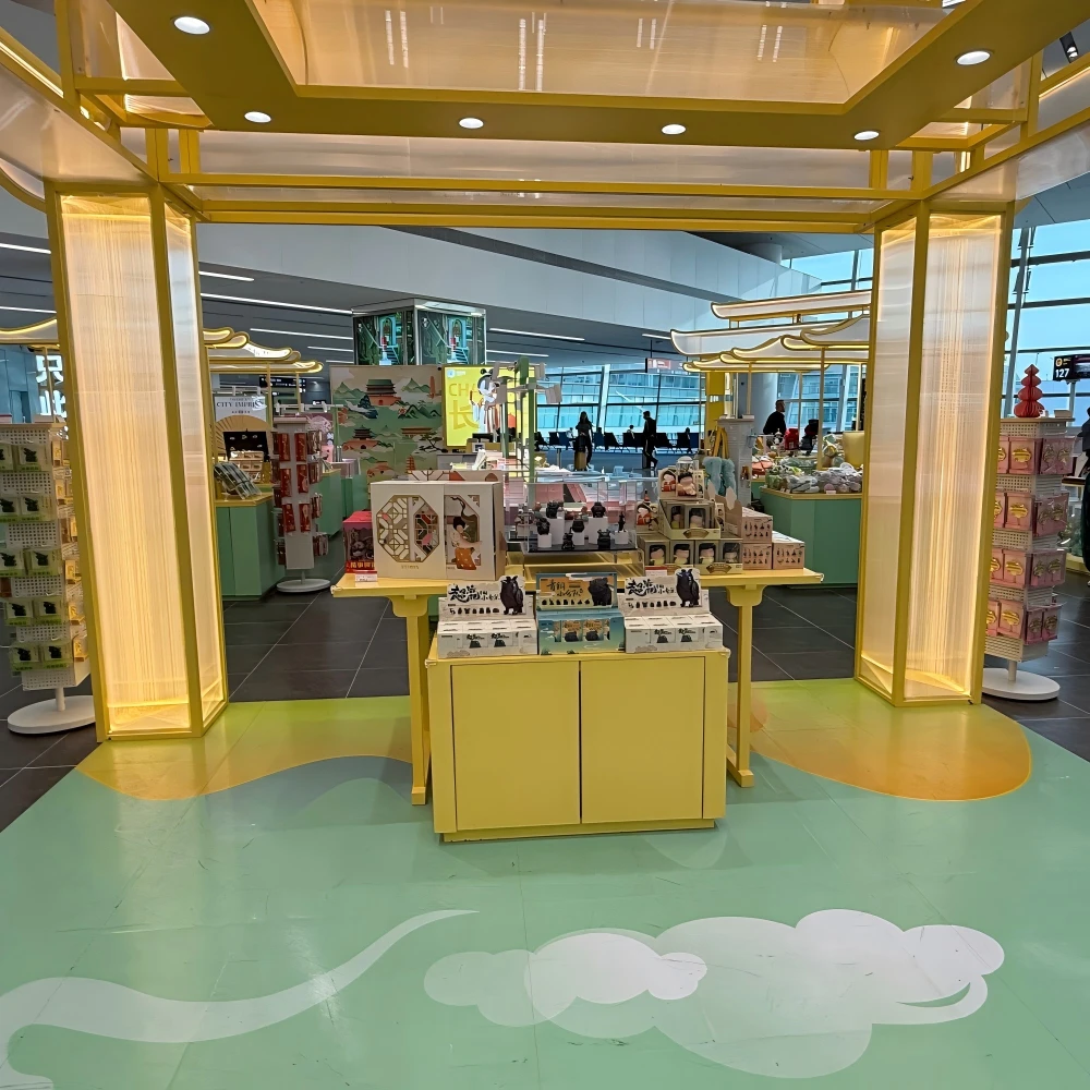 Interior view of pavilion-frame merchandise bays with translucent screen panels and branded backlit posters in a modern retail store design live store