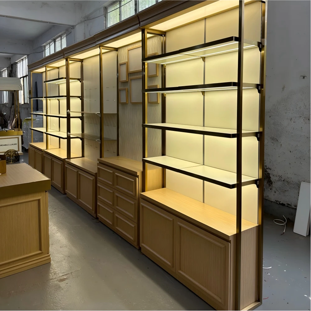 Circular experience island with rinse sink, rotating tiered trays and champagne-gold body in a retail design and build QC floor sample