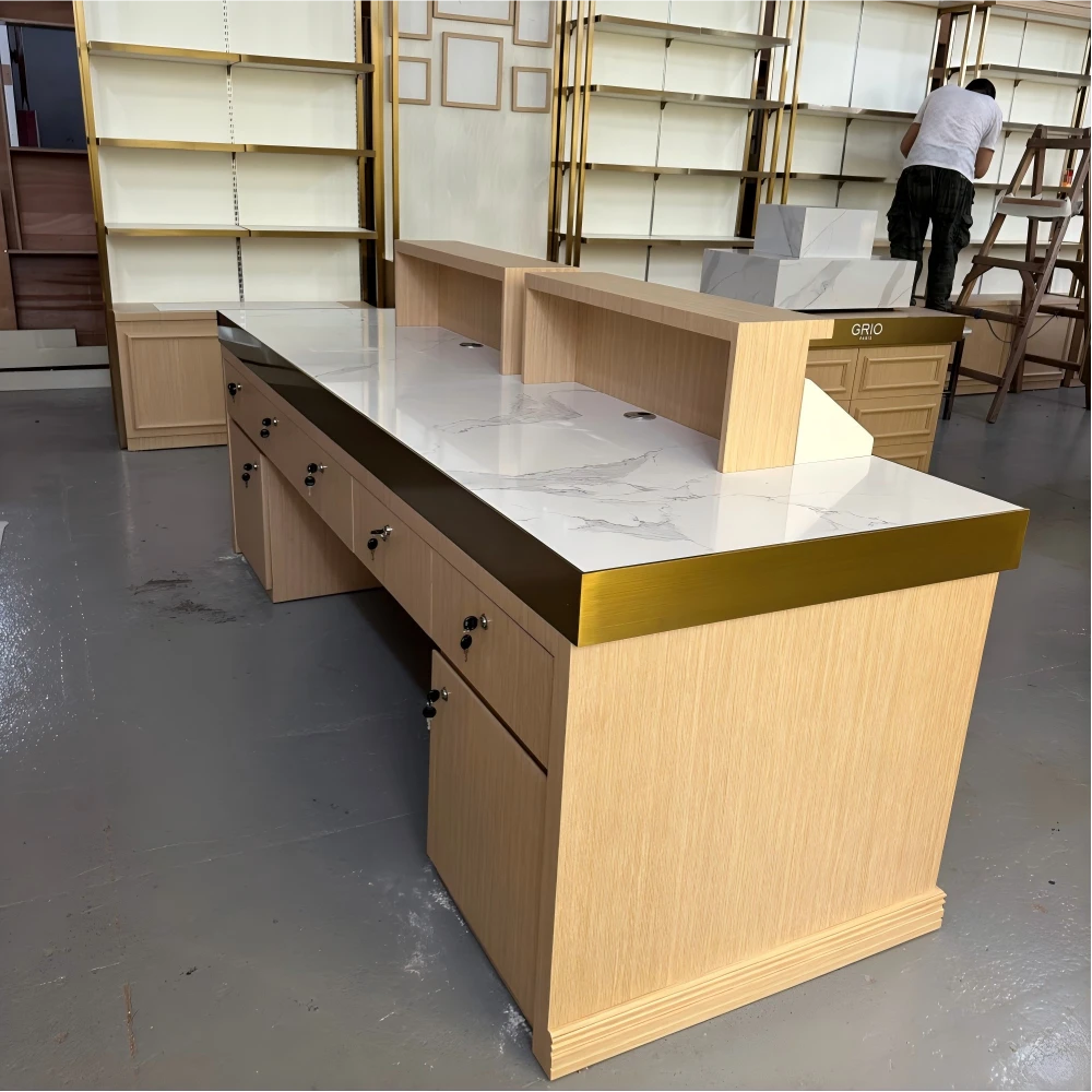 Back view of tall display cabinets showing plywood crate packaging and export-ready wrapping in a retail design and build QC floor