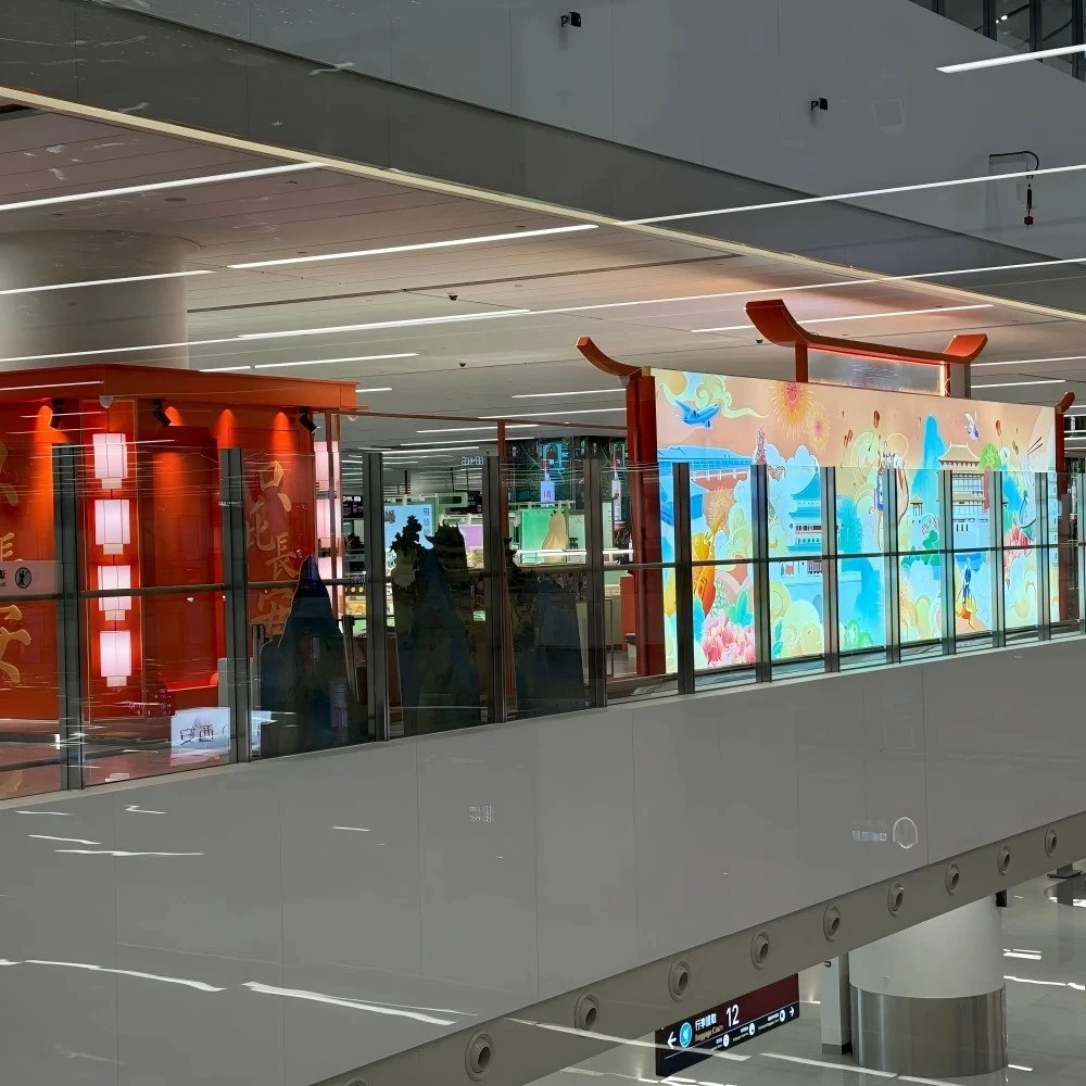 Retail store design ideas featuring a long-scroll glass mural and curved-roof silhouette along the mezzanine guardrail installation