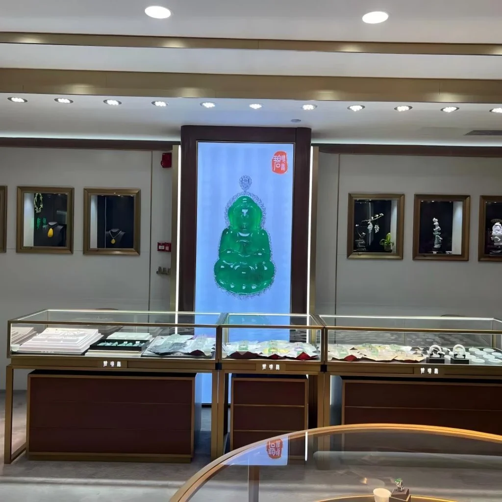 Curved consultation counter with tempered glass top for seated VIP jewelry service