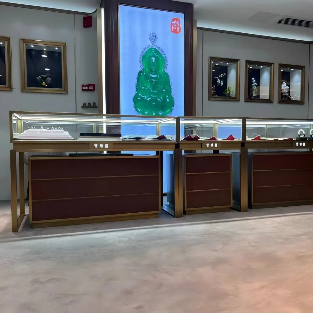 Backlit feature panel above glass-top counters in a whole-store jade boutique fit-out