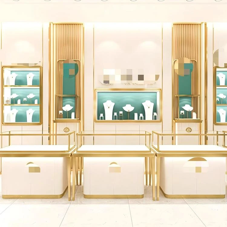 Champagne-gold framed display counters and wall showcase cabinets in a gallery-style jewelry boutique