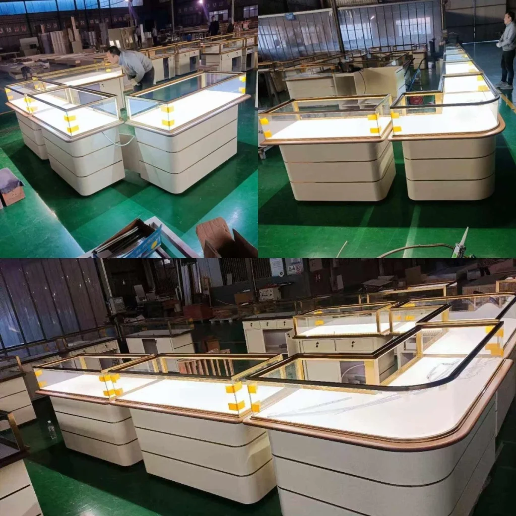 Workshop assembly of jewelry showcase display counters with lighted decks, photographed before shipping