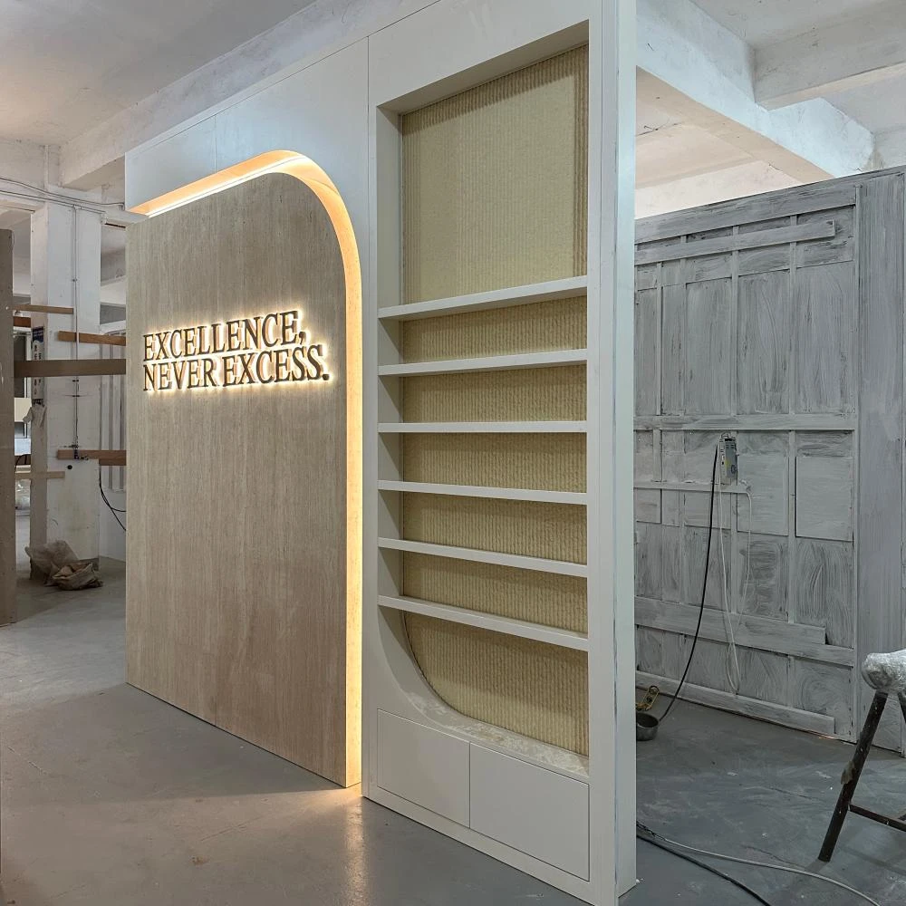 Sliding-door display shelf with arched silhouette and rope-texture back panel paired with a backlit slogan wall, nail salon furniture production sample