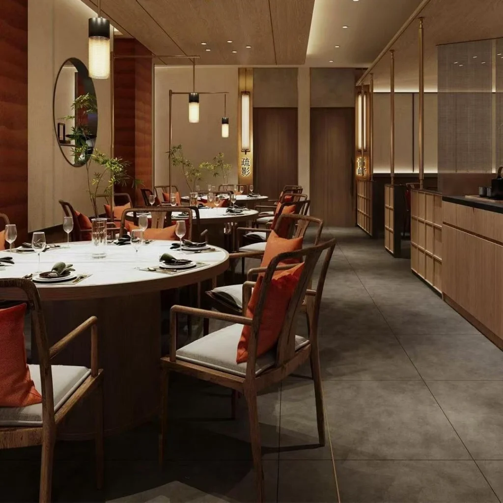 Round-table dining group with white marble tops and orange cushions in a restaurant interior fit out rendering