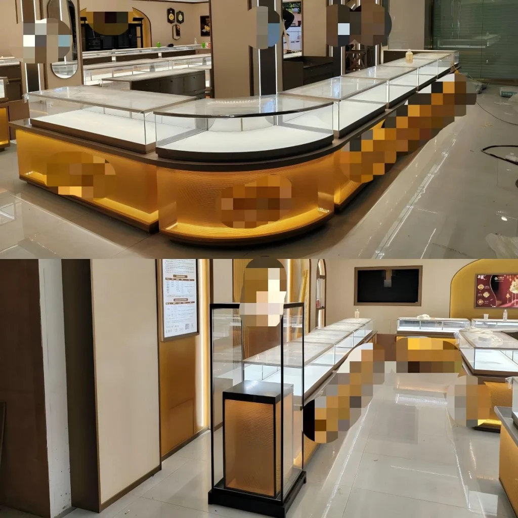 LED display case detail: backlit island counter with white tray inserts, and perimeter run with illuminated base toward the service zone