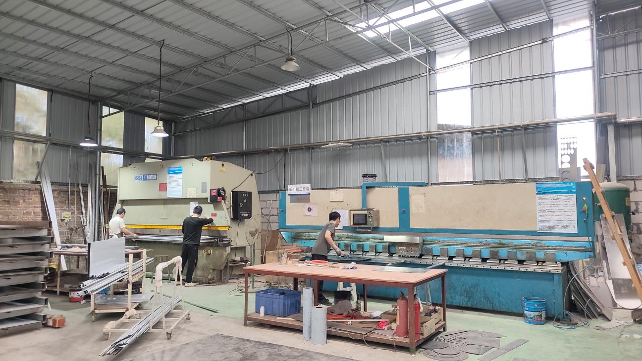 Metal bending machine forming stainless steel display case frame