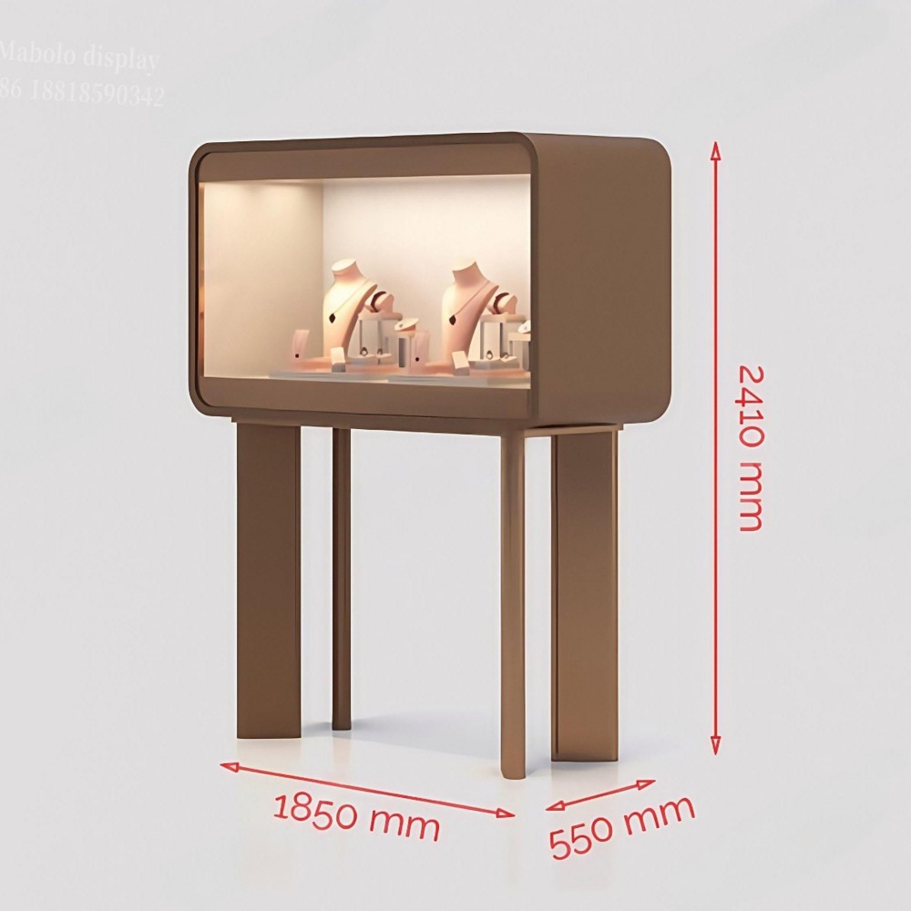 Three-quarter view of the freestanding glass display case with lights, showing the bronze frame and four legs