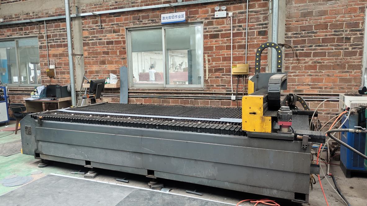 laser cutting machine cutting custom metalwork for a jewelry display case