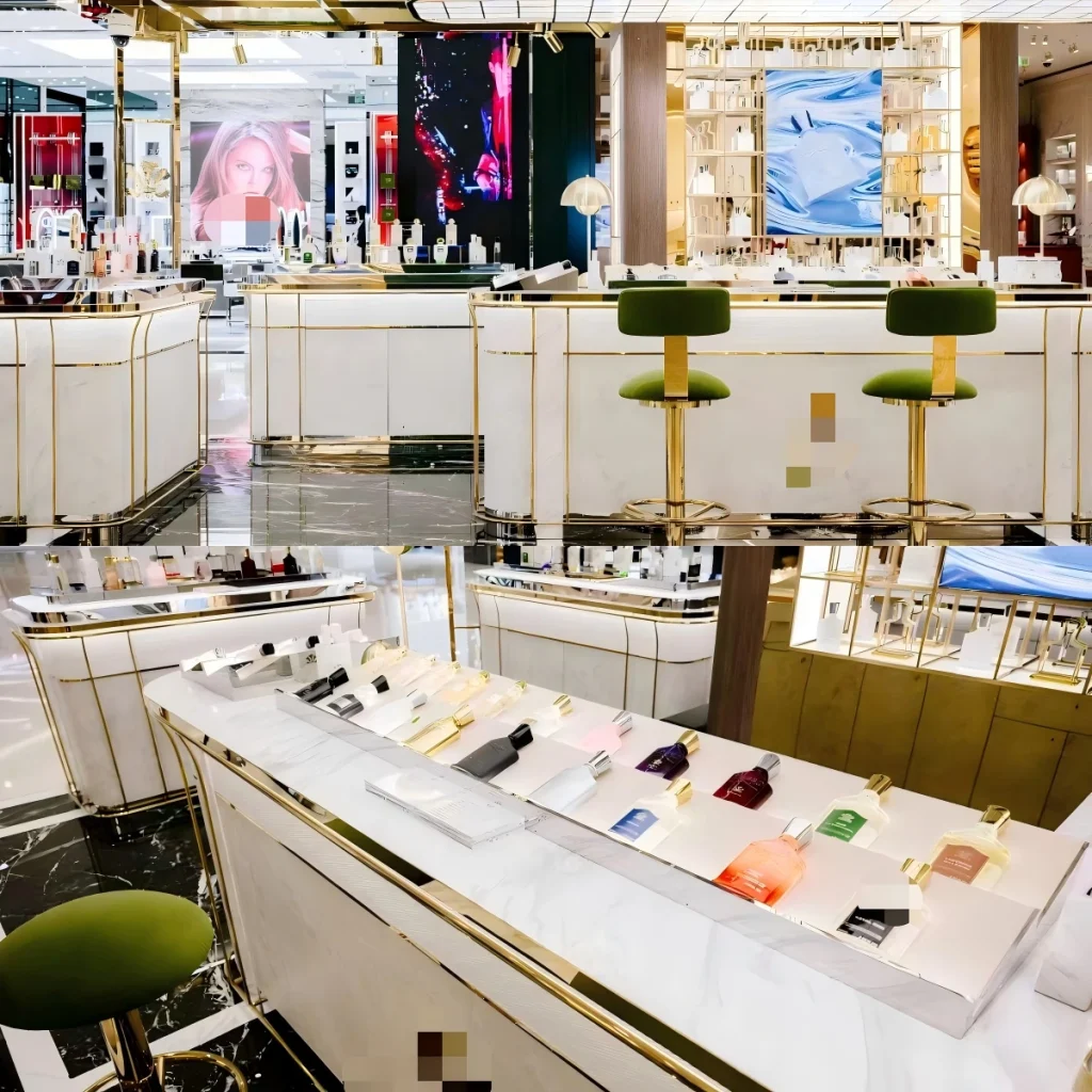 Perfume shelf display banks with illuminated ledges and tiered acrylic risers on marble counter tops