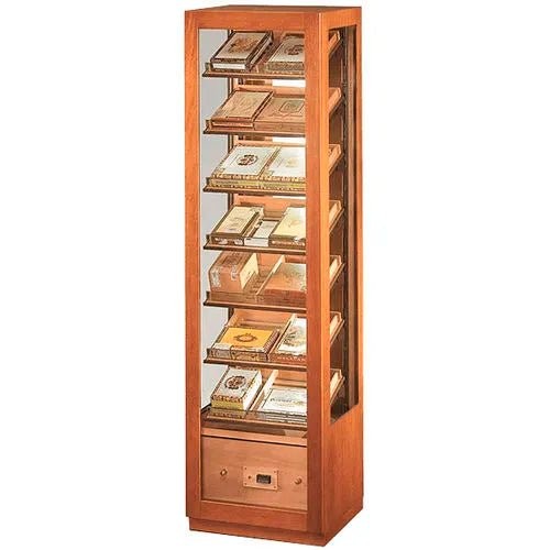 Cedar cigar cabinet in light wood with a glass door and cigar boxes on its display shelves