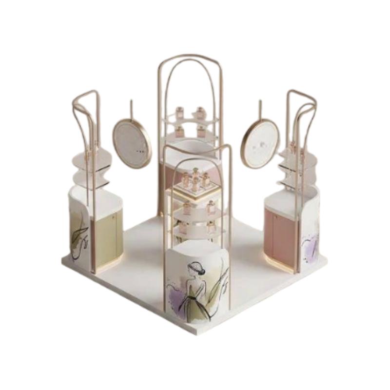 watercolour beauty kiosk enclosed by rounded champagne gold arches with a hanging circular logo medallion