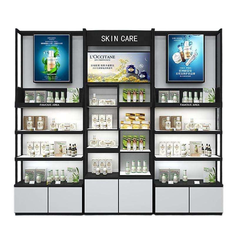 Store display shelving DS-35, a three-bay illuminated cosmetics wall shelving system with poster lightboxes and white storage cabinets